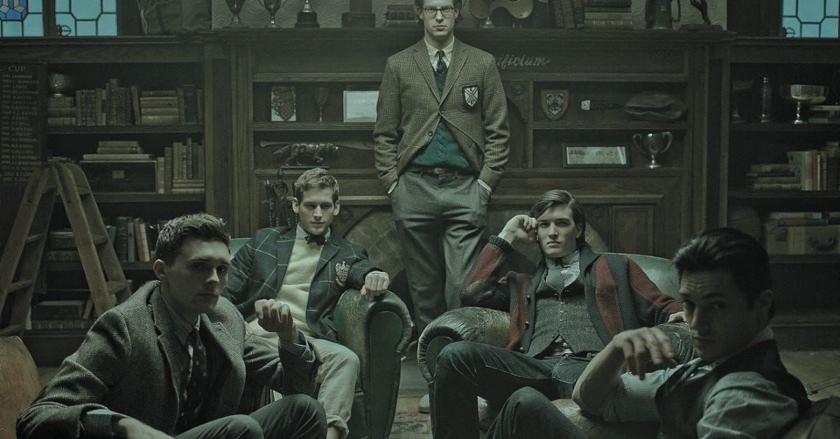 A group of men seated in a room surrounded by bookshelves, embodying the Old Money aesthetic of discreet elegance.