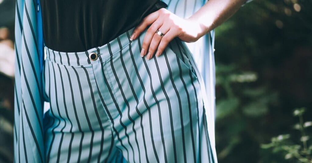 Old money striped pants paired with a chic black top showcase true old money fashion.