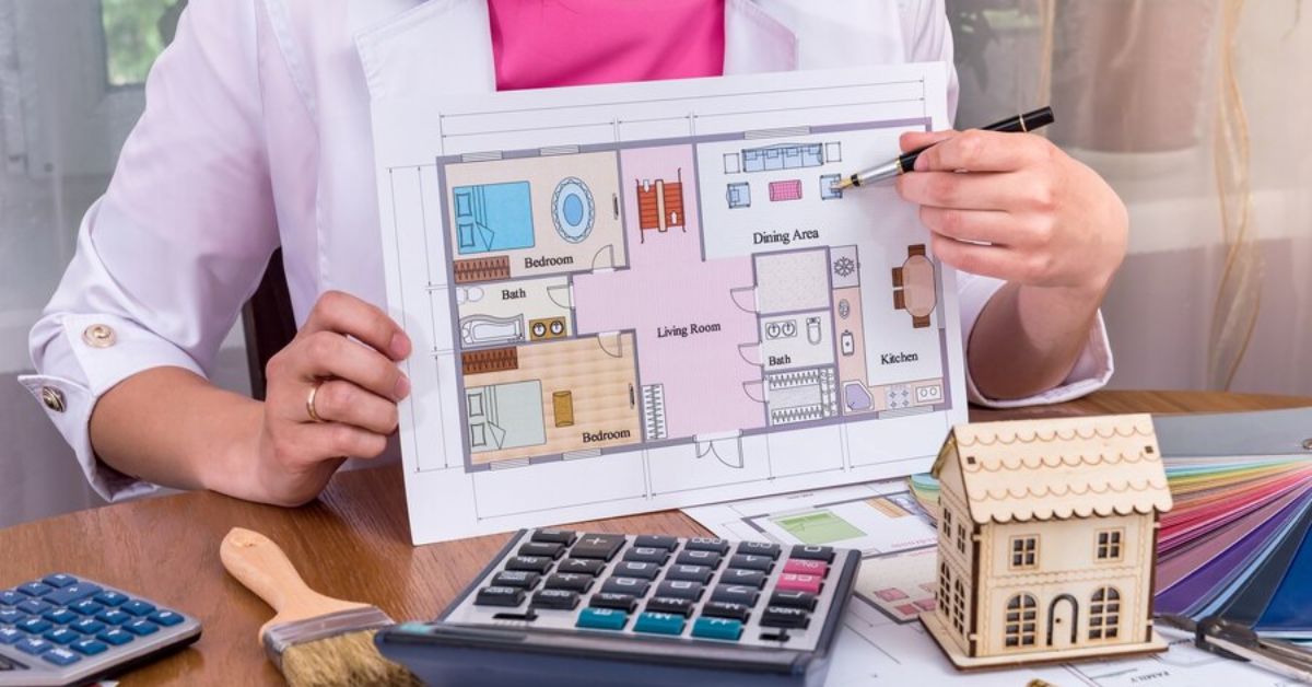 A woman examines a house blueprint, planning her dream home with a focus on budgeting and old money style.